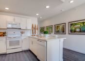 Thumbnail 6 of 65 - Well Lit Kitchen Hallway at Aviator at Brooks,Texas