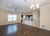 Thumbnail 1 of 22 - A spacious kitchen with a bar area and a ceiling fan. at Logan Ridge Apartments, Texas, 78666