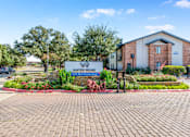 Thumbnail 2 of 42 - A sign in front of a building that says Water Ridge at Water Ridge Apartments , Irving, Texas