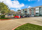 Thumbnail 28 of 37 - Shaded Parking Area at Newport Apartments, Irving, TX