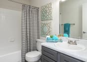 Thumbnail 11 of 35 - a bathroom with a toilet sink and bathtub  at Sunset Canyon, San Antonio, TX, 78232