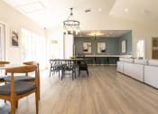 Thumbnail 18 of 35 - a living room and dining room with a hardwood floor and a vaulted ceiling  at Sunset Canyon, San Antonio, TX, 78232