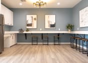 Thumbnail 17 of 35 - a kitchen with a long counter and stools  at Sunset Canyon, San Antonio, TX