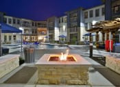 Thumbnail 17 of 22 - an outdoor area with a fire pit at night at The Grand at Stonecreek, San Marcos, 78666