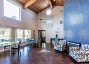 Thumbnail 38 of 55 - a living room and dining room with a glass table and chairs at Water Ridge Apartments, Irving, TX