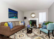 Thumbnail 44 of 55 - a living room with a couch and a chair at Water Ridge Apartments, Irving, TX 75061