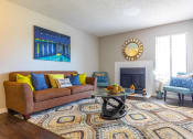 Thumbnail 1 of 55 - a living room with a couch and a coffee table at Water Ridge Apartments, Irving
