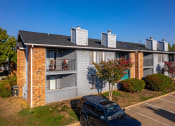 Thumbnail 51 of 55 - an apartment building with a car parked in front of it at Water Ridge Apartments, Irving, TX 75061
