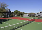 Thumbnail 32 of 55 - a tennis court with green and red lines on it at Water Ridge Apartments, Irving, TX