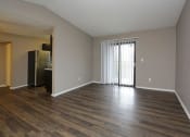 Thumbnail 12 of 55 - an empty living room with a refrigerator and at Water Ridge Apartments, Irving, TX 75061