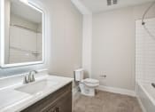 Thumbnail 26 of 35 - a bathroom with a toilet and a sink and a mirror at The Virginia, Texas