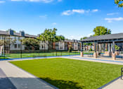 Thumbnail 14 of 42 - A sunny day at the park with a blue sky and a green lawn at Water Ridge Apartments , Irving, 75061