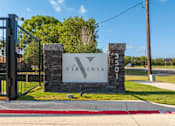 Thumbnail 48 of 52 - A sign that says Virginia is on a stone pillar at The Virginia Apartments , Seguin, TX