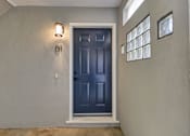 Thumbnail 2 of 23 - A blue door with a number 01 on the wall above it.