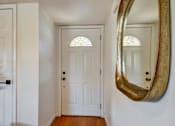 Thumbnail 21 of 39 - A white door with a glass window above it.