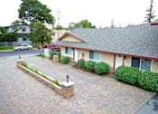 Thumbnail 15 of 16 - a view of the front of a house with a driveway
