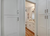 Thumbnail 15 of 27 - A white cabinet with a mirror and lights is open.