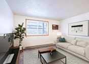 Thumbnail 1 of 13 - A living room with a couch, coffee table, and a plant. Fargo, ND Candlelight Apartments