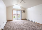 Thumbnail 3 of 23 - A room with a carpeted floor and a ceiling fan. Fargo, ND Summit Point Apartments
