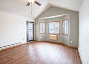 Thumbnail 10 of 23 - A room with a ceiling fan and three windows. Fargo, ND Somerset Apartments