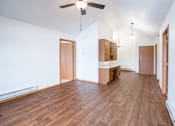 Thumbnail 11 of 23 - A room with wooden floors and a ceiling fan. Fargo, ND Somerset Apartments