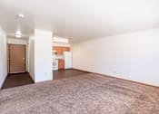 Thumbnail 10 of 16 - A room with a brown carpet and white walls. Fargo, ND Birchwood 2 Apartments