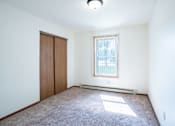 Thumbnail 13 of 30 - A room with a window and a door.