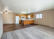 Thumbnail 2 of 13 - A kitchen with wooden cabinets and a white refrigerator.