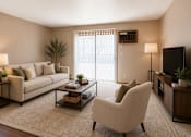 Thumbnail 1 of 13 - A living room with a white sofa, a white chair, a coffee table, and a flat screen TV.