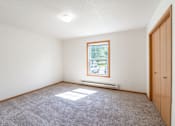 Thumbnail 40 of 54 - A room with a window and a door. Fargo, ND Stonebridge Apartments