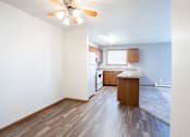 Thumbnail 13 of 42 - A room with a ceiling fan and wooden flooring. Fargo, ND Westwood Estates