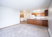 Thumbnail 34 of 42 - A kitchen area with a counter and cabinets. Fargo, ND Westwood Estates