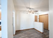 Thumbnail 9 of 42 - A room with a ceiling fan and a white wall. Fargo, ND Westwood Estates