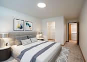 Thumbnail 11 of 46 - A bedroom with a bed, nightstand, and two framed pictures on the wall.