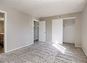 Thumbnail 31 of 34 - A room with carpeted floor and white walls. Omaha, NE Evergreen Terrace Apartments