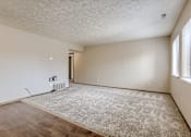 Thumbnail 14 of 29 - A room with a carpet, wooden floor and a window. Omaha, NE Stony Brook Apartments