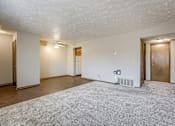Thumbnail 15 of 29 - A spacious room with a carpeted floor. Omaha, NE Stony Brook Apartments