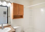 Thumbnail 24 of 26 - A white bathroom with a sink, toilet and bathtub. Fargo, ND Pacific Park I Apartments