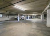 Thumbnail 28 of 29 - a parking garage with a truck parked in it