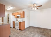 Thumbnail 22 of 30 - A kitchen with a refrigerator, stove, and oven. Fargo, ND Long Island Apartments