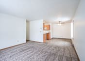 Thumbnail 16 of 30 - A room with a carpeted floor and a ceiling fan. Fargo, ND Long Island Apartments