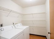 Thumbnail 24 of 25 - A laundry room with a washer and dryer. Fargo, ND Park Place Apartments