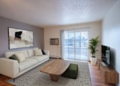 Thumbnail 5 of 25 - A living room with a white couch and a wooden coffee table. Fargo, ND Park Place Apartments