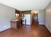 Thumbnail 21 of 35 - A kitchen with a refrigerator, oven, and sink. Little Canada, MN Montreal Courts