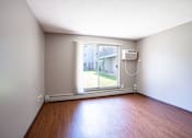 Thumbnail 20 of 35 - A room with a window and a wall-mounted air conditioner. Little Canada, MN Montreal Courts