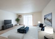Thumbnail 1 of 14 - A living room with a blue couch and a television. Fargo, ND Crown Court Apartments