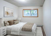 Thumbnail 4 of 14 - A bedroom with a large bed and a window. Fargo, ND Park Terrace Apartments