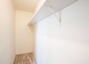 Thumbnail 18 of 28 - A room with a carpeted floor and a white ceiling. West Fargo, ND Sheyenne Terrace Townhomes