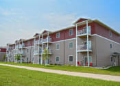 Thumbnail 1 of 23 - an exterior view of an apartment building on a sunny day. Fargo, ND North Sky Apartments