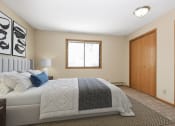 Thumbnail 6 of 29 - a bedroom with a bed and a window. Anoka, MN Dellwood Estates